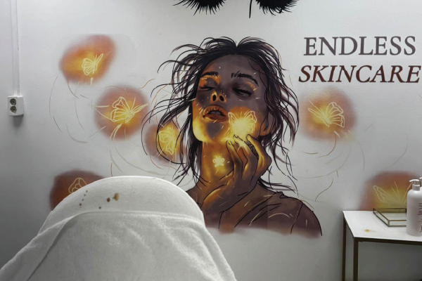 Custom wall print in beauty salon with skincare themed artwork