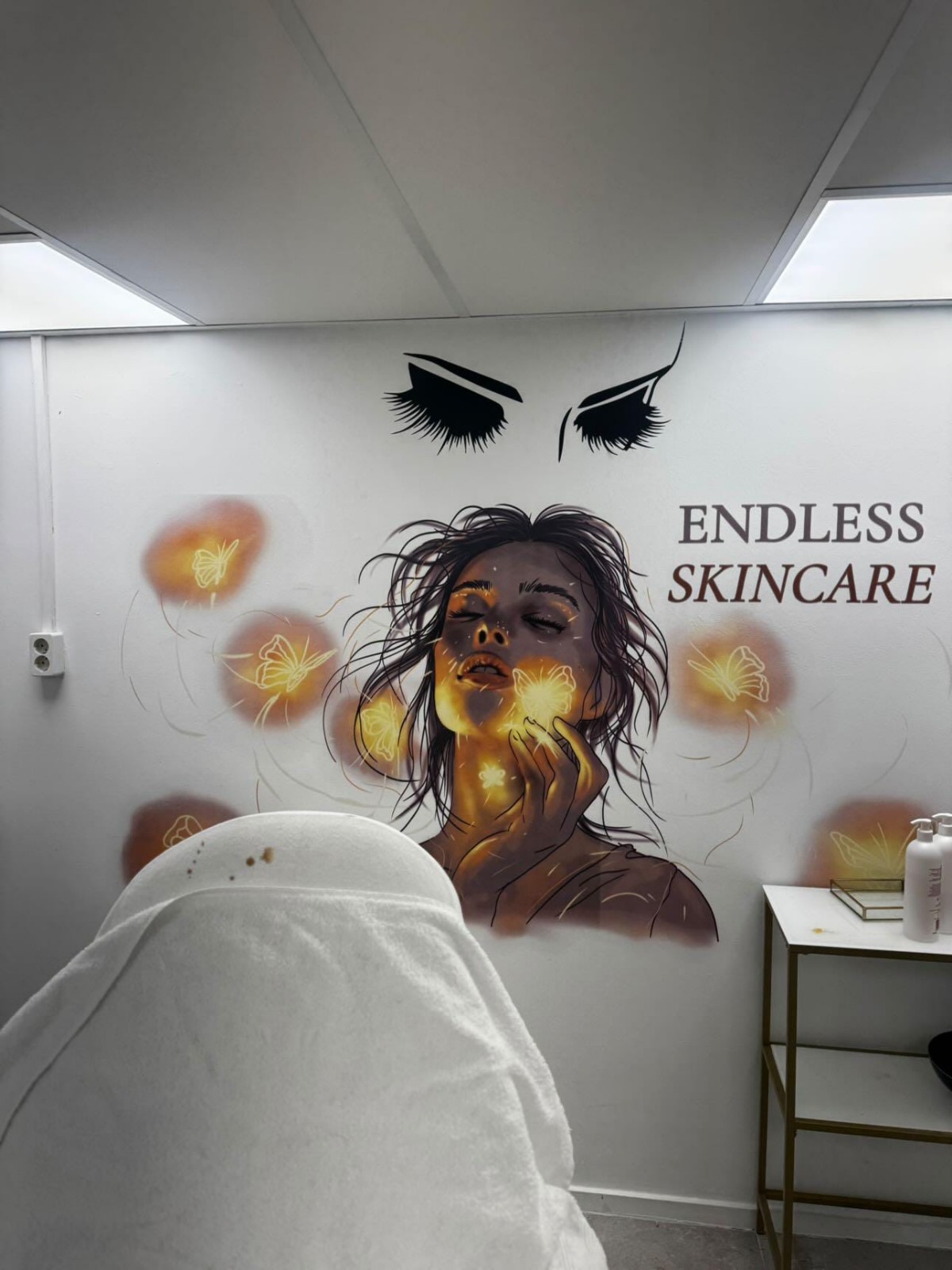 Custom wall print in beauty salon with skincare themed artwork