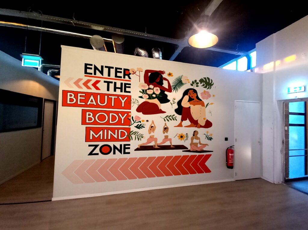 Custom painted wall mural with illustrative artwork in commercial interior