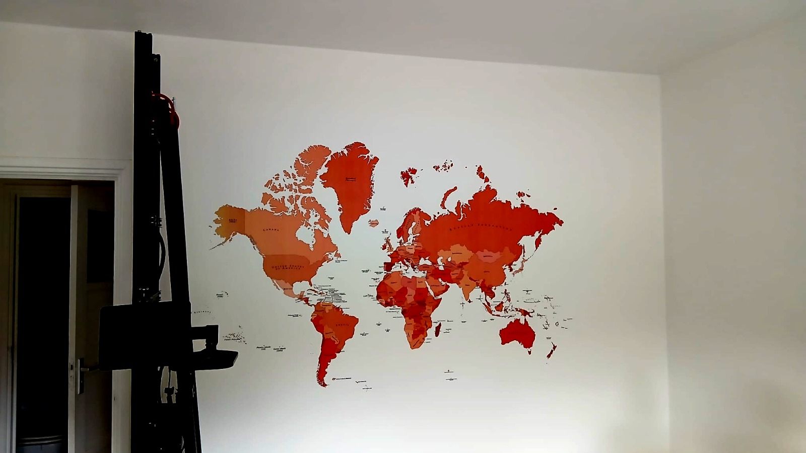 Custom world map wall print in modern interior