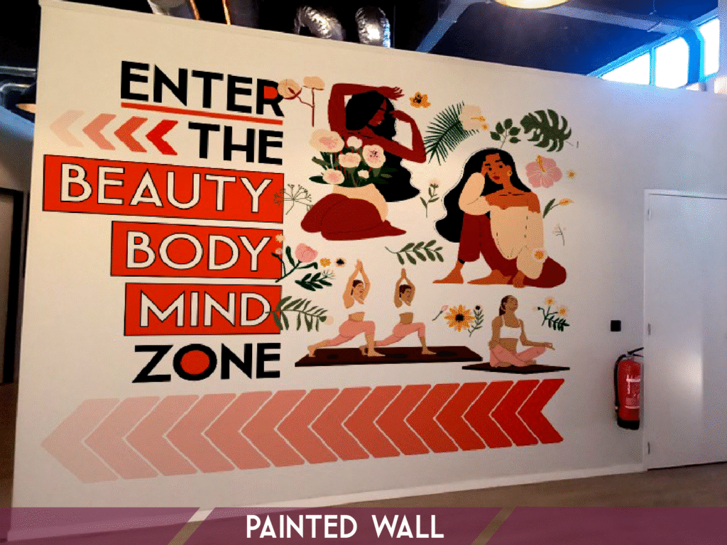 Custom painted wall mural with illustrative artwork in commercial interior